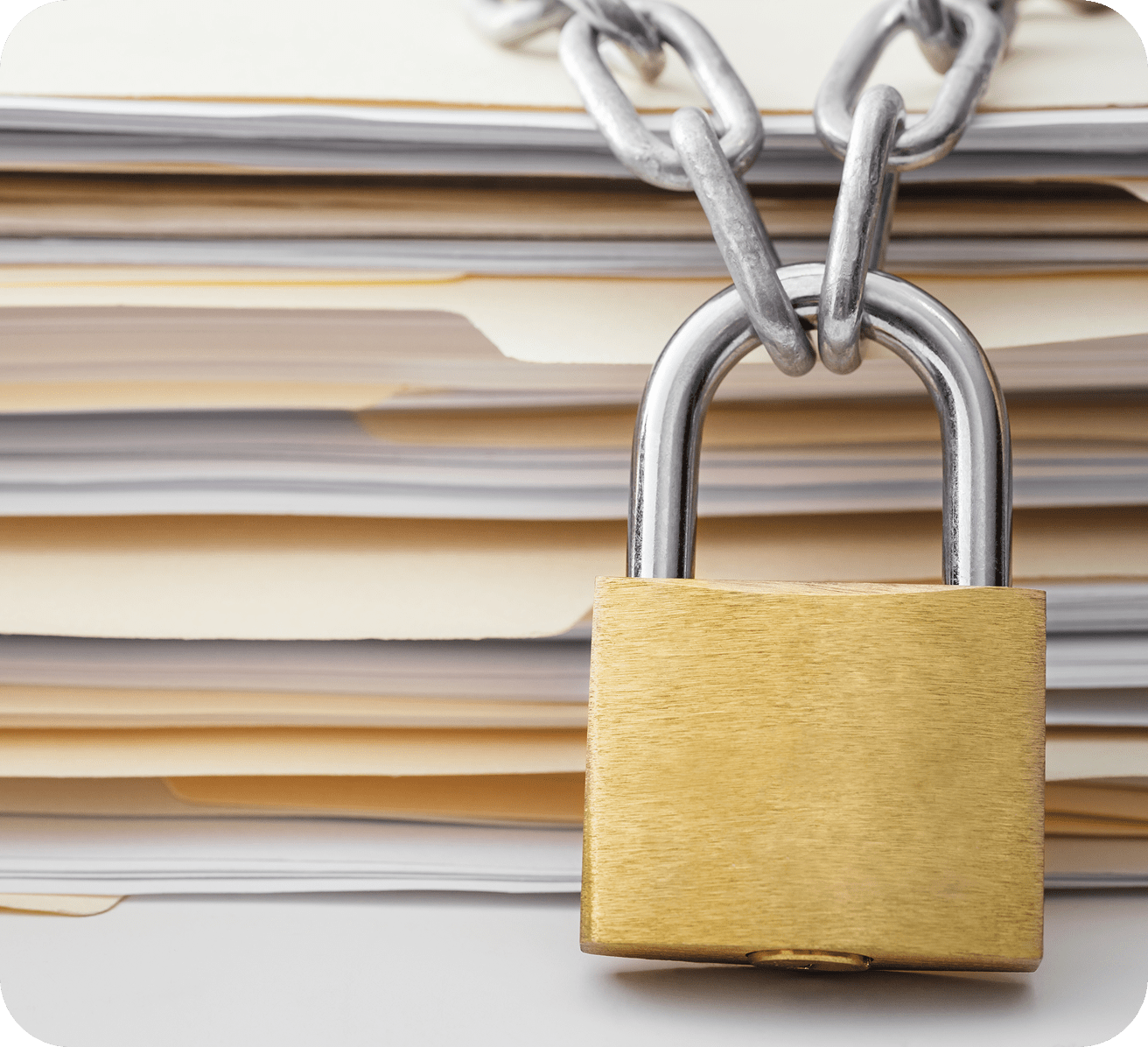 GettyImages-1182468317-15 Locked padlock on stacked paper files.